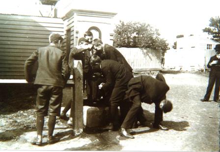 Students playing near the Water Pump, circa 1908.
